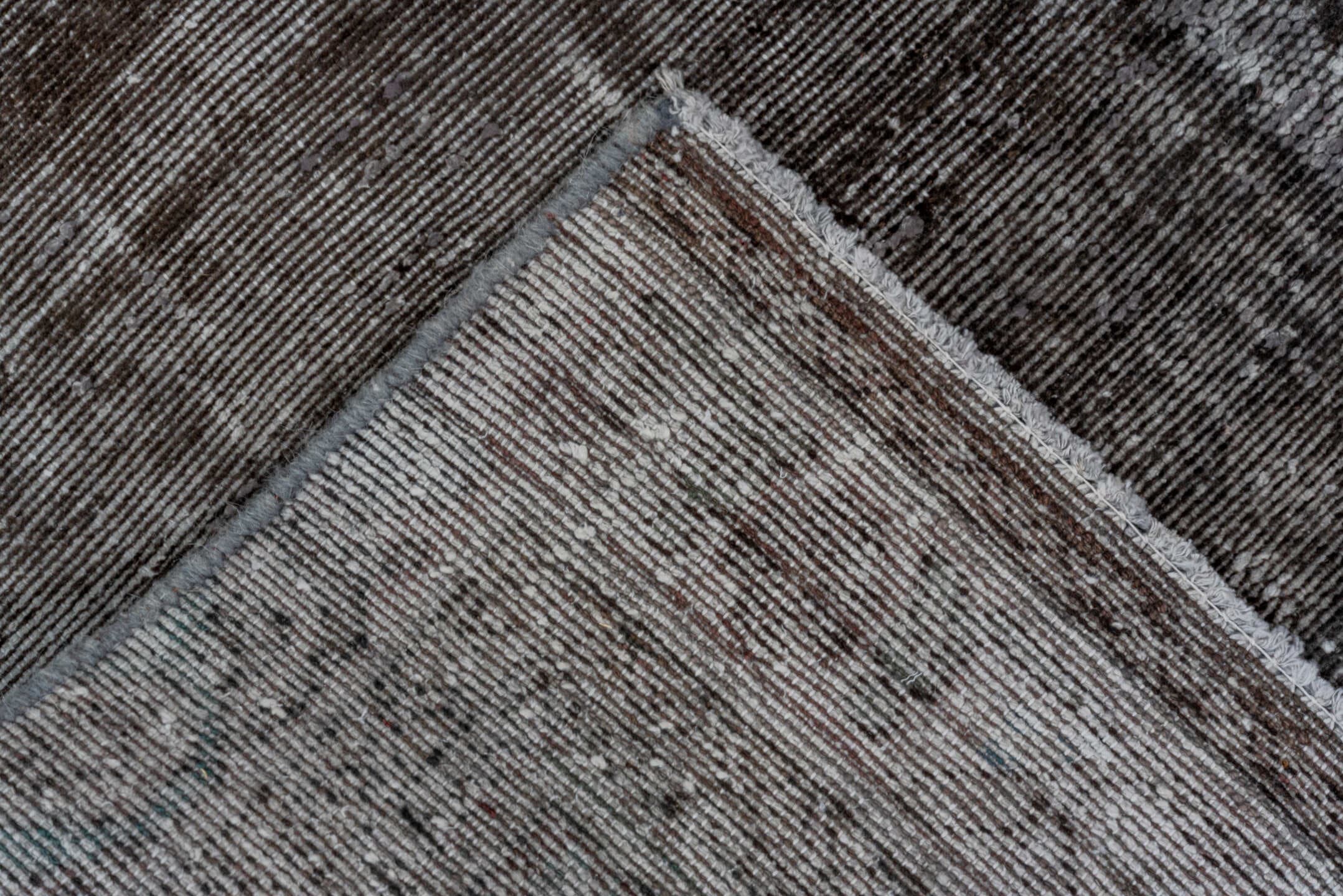 4' x 11' one-of-a-kind handmade vintage Distressed runner rug. Color palette: charcoal, silver, gray, taupe, black, beige