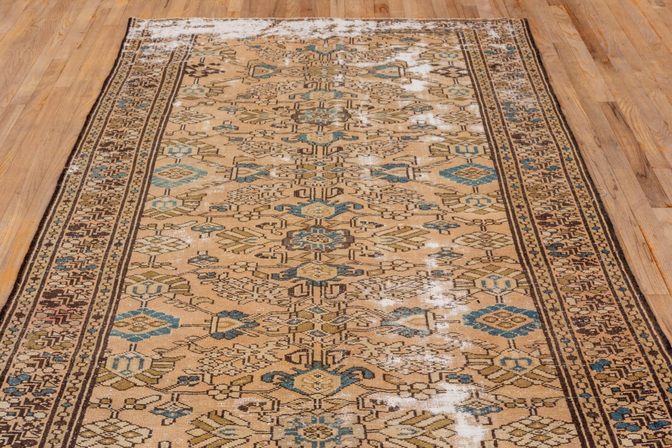 5' x 9' one-of-a-kind handmade vintage Distressed medium size rug. Color palette: tan, ivory, brown, muted blue, taupe
