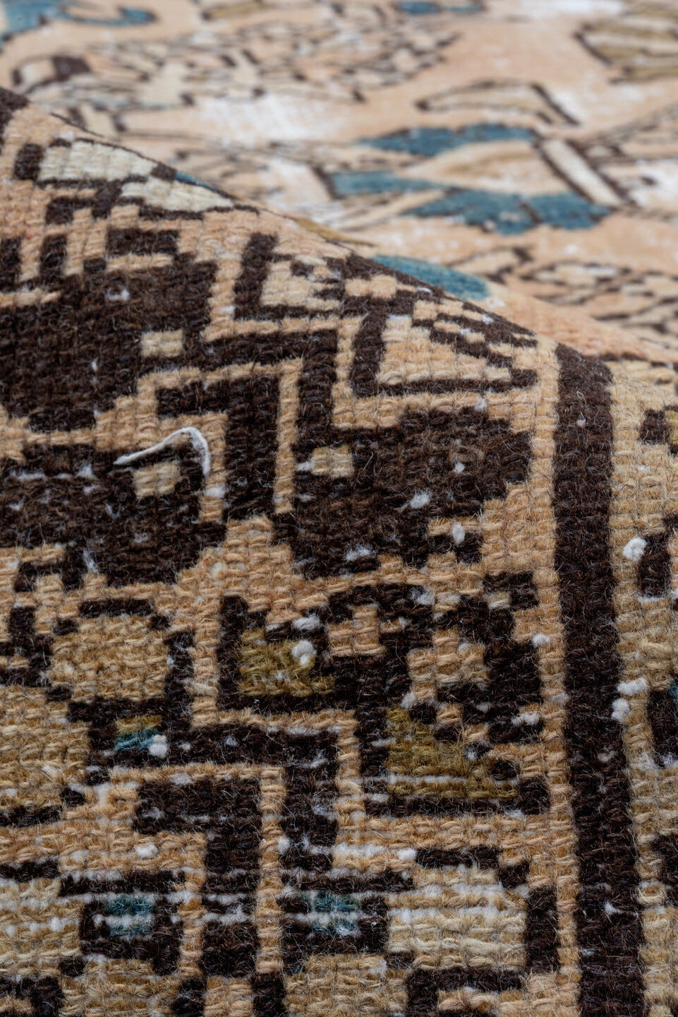 5' x 9' one-of-a-kind handmade vintage Distressed medium size rug. Color palette: tan, ivory, brown, muted blue, taupe