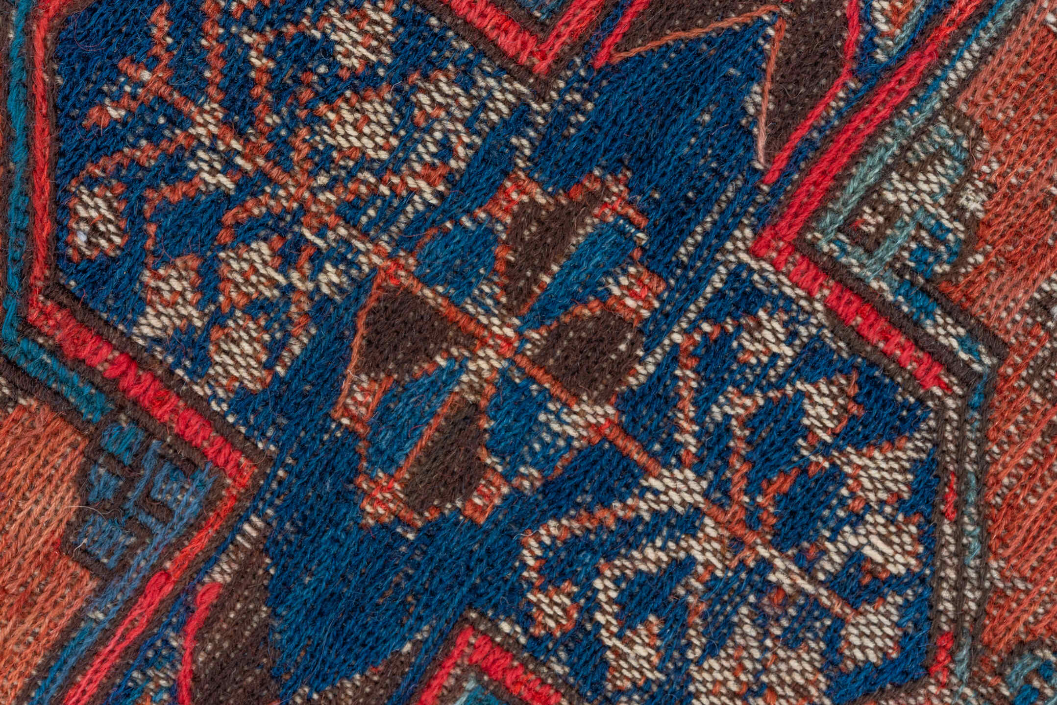 6' x 9' one-of-a-kind handmade antique Sumak medium size rug. Color palette: terra cotta, indigo, sky blue, rust, crimson