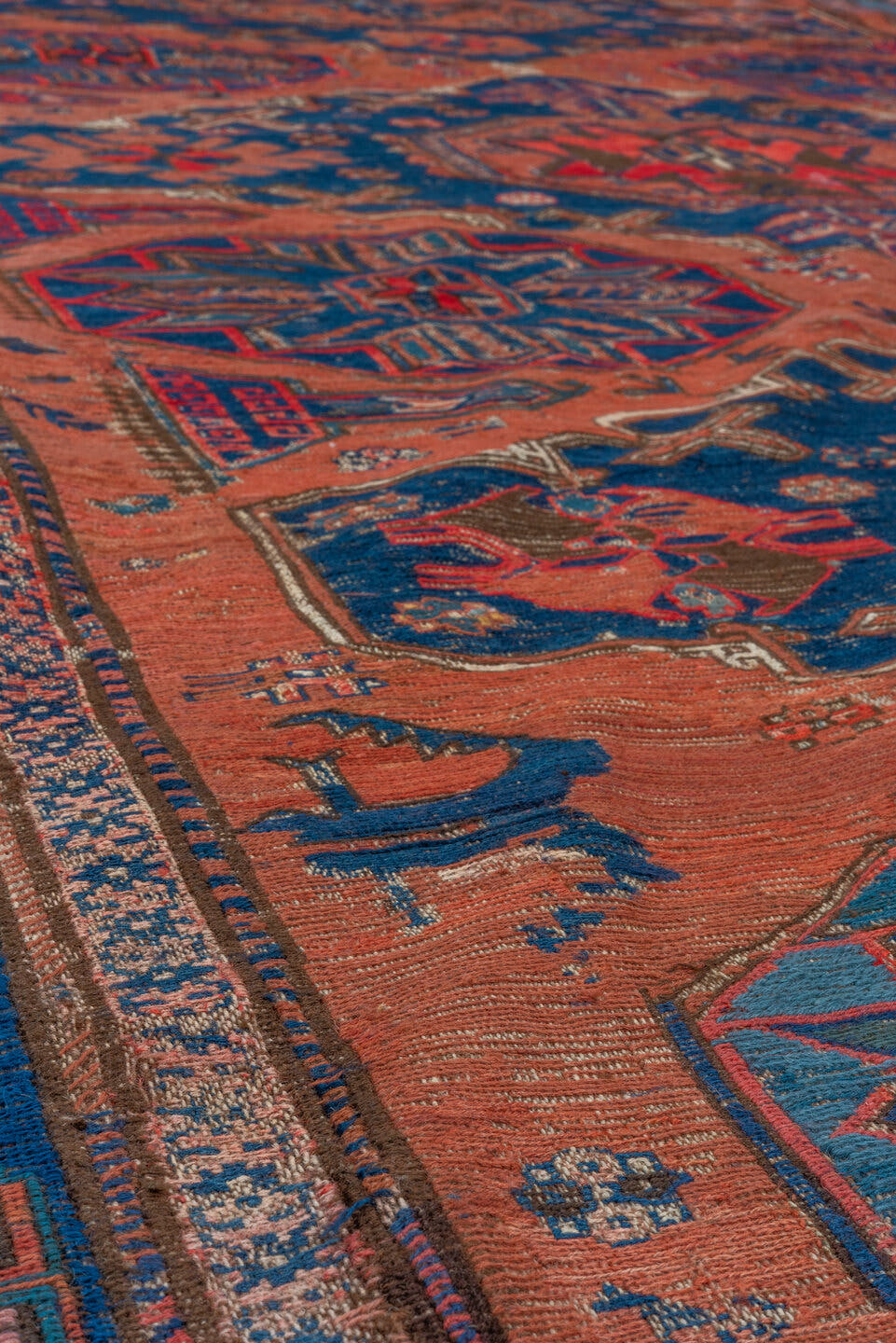 6' x 9' one-of-a-kind handmade antique Sumak medium size rug. Color palette: terra cotta, indigo, sky blue, rust, crimson