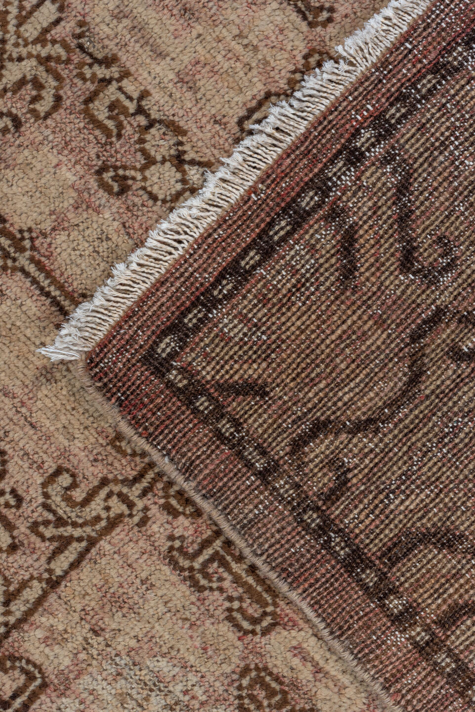 6' x 9' one-of-a-kind handmade vintage Khotan medium size rug. Color palette: black, brown, gray, light gray, pink
