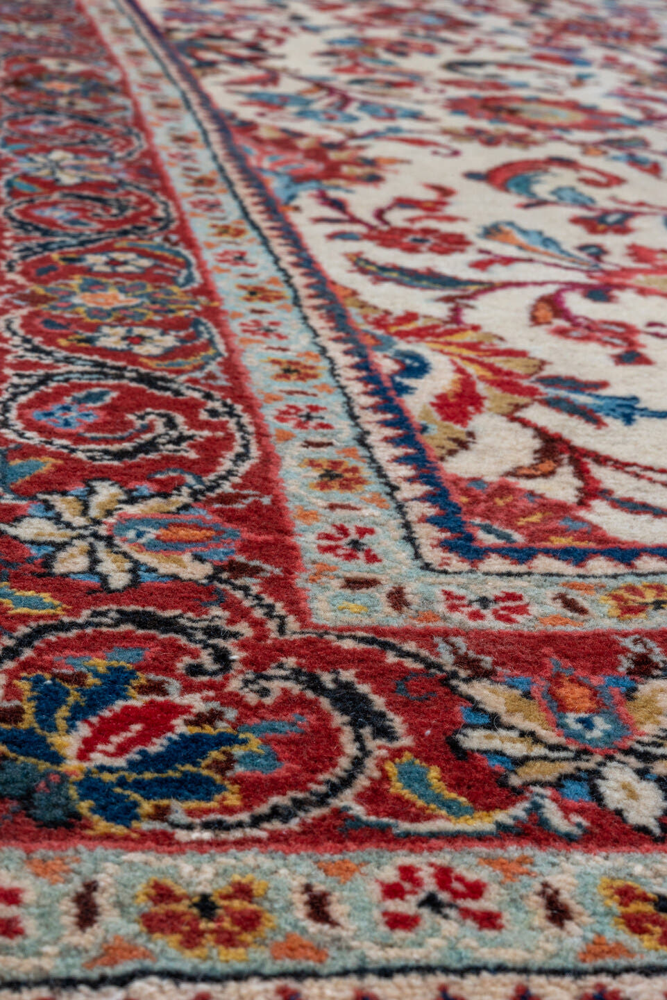 4' x 9' one-of-a-kind handmade antique Sarouk runner rug. Color palette: ivory, camel, rust, light blue, sage, gold, brown