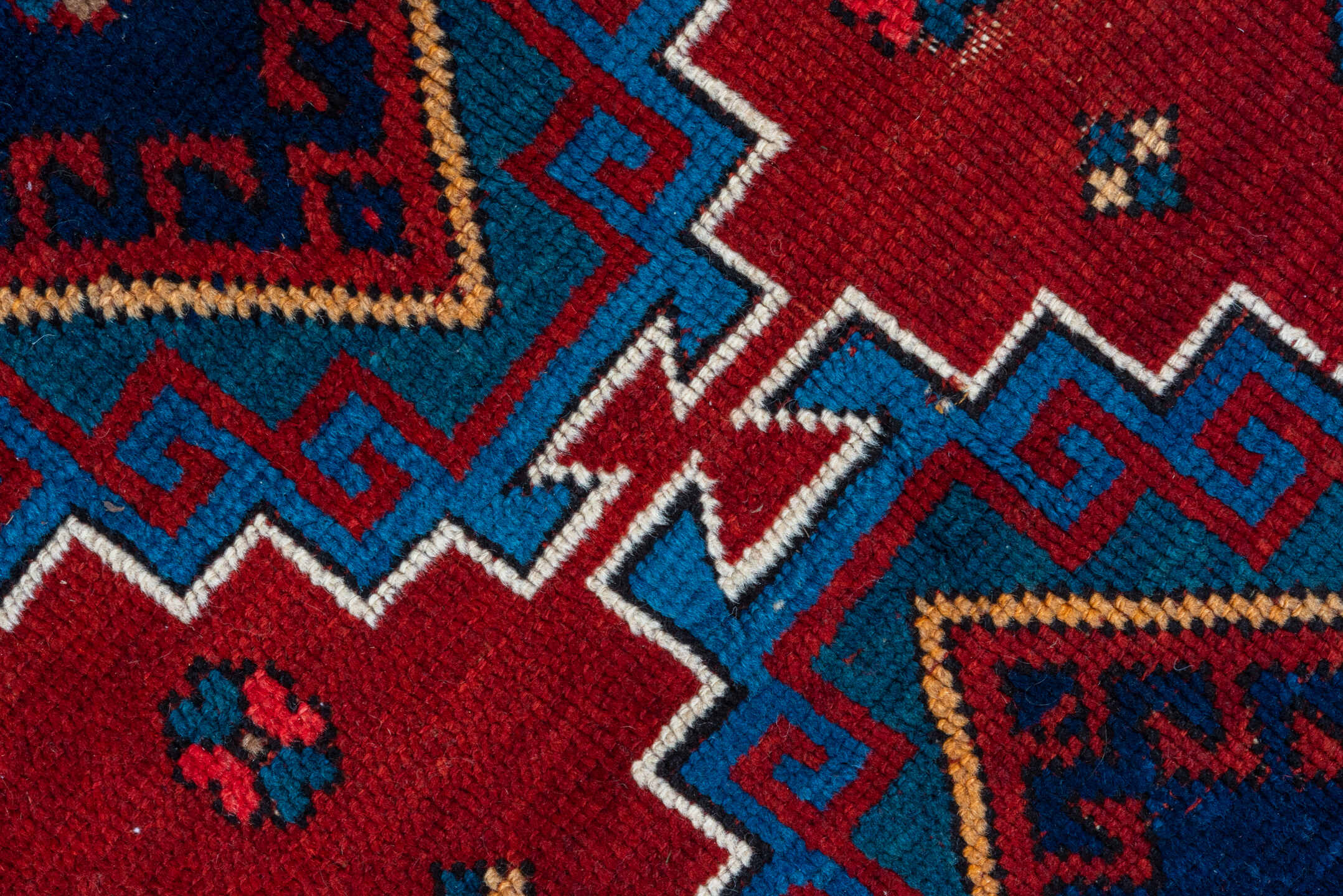 4' x 10' one-of-a-kind handmade antique Kazak runner rug. Color palette: red, navy, sky blue, ivory, crimson, charcoal, rose