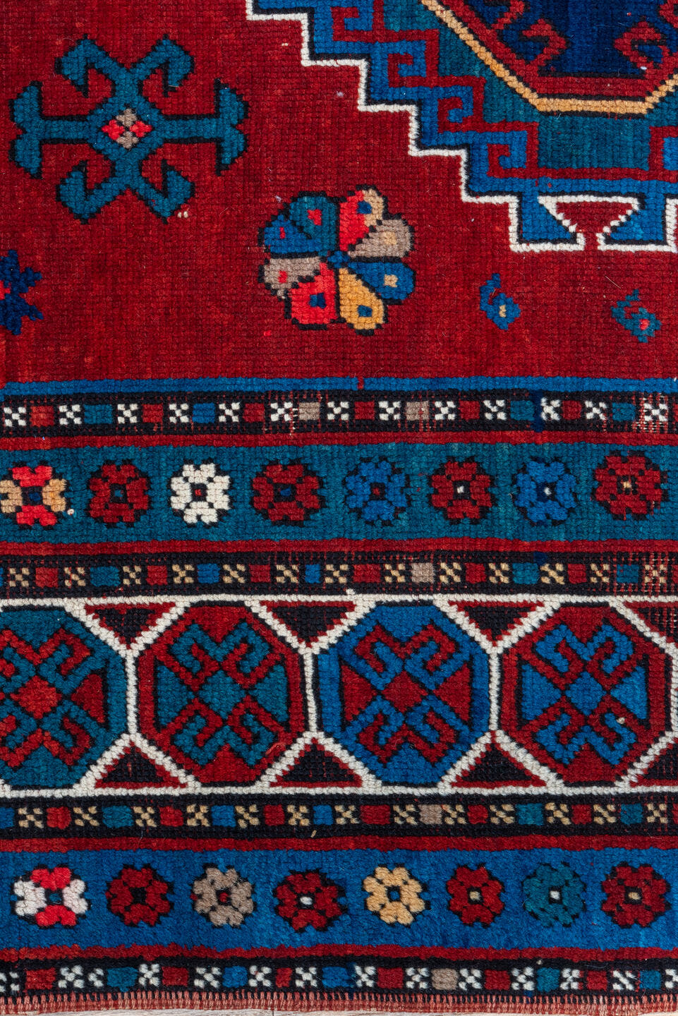 4' x 10' one-of-a-kind handmade antique Kazak runner rug. Color palette: red, navy, sky blue, ivory, crimson, charcoal, rose