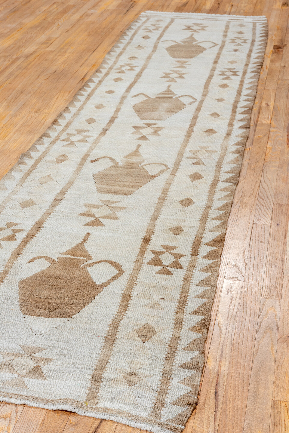 2' x 11' one-of-a-kind handmade antique Kilim runner rug. Color palette: ivory, taupe, brown, camel, beige, gray