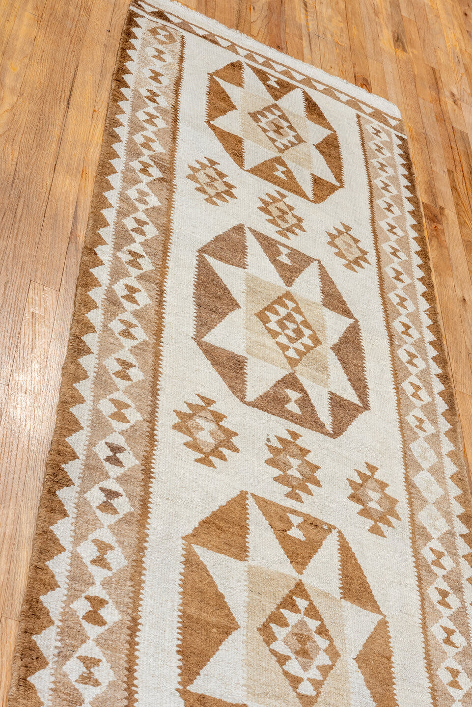 2' x 10' one-of-a-kind handmade antique Kilim runner rug. Color palette: ivory, taupe, camel, brown, beige, gray