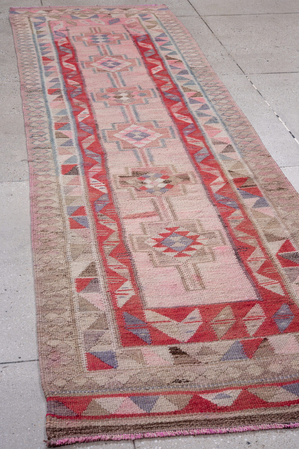 3' x 11' one-of-a-kind handmade vintage Kilim runner rug. Color palette: blush, taupe, red, rose, soft blue, ivory, mauve