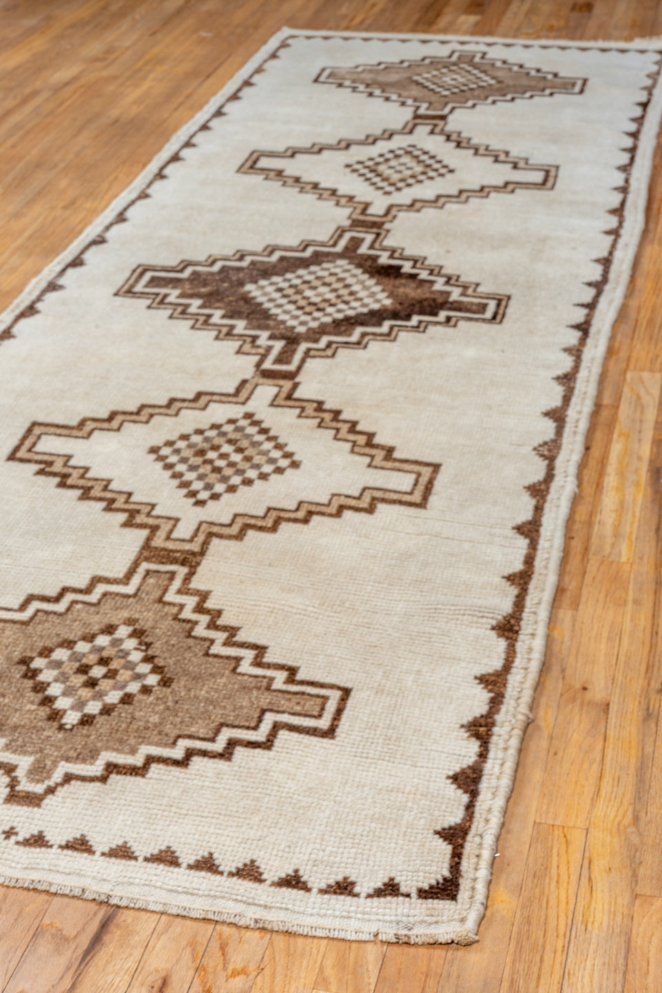 3' x 10' one-of-a-kind handmade vintage Kars runner rug. Color palette: brown, gray, light gray, off-white, orange, pink