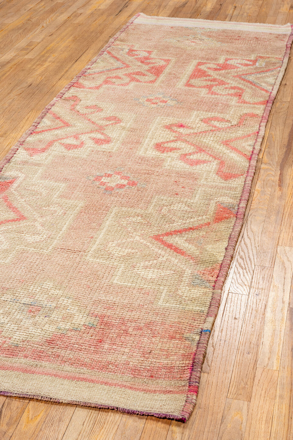 3' x 10' one-of-a-kind handmade vintage Kars runner rug. Color palette: blush, ivory, taupe, coral, rose, beige, pink, gray