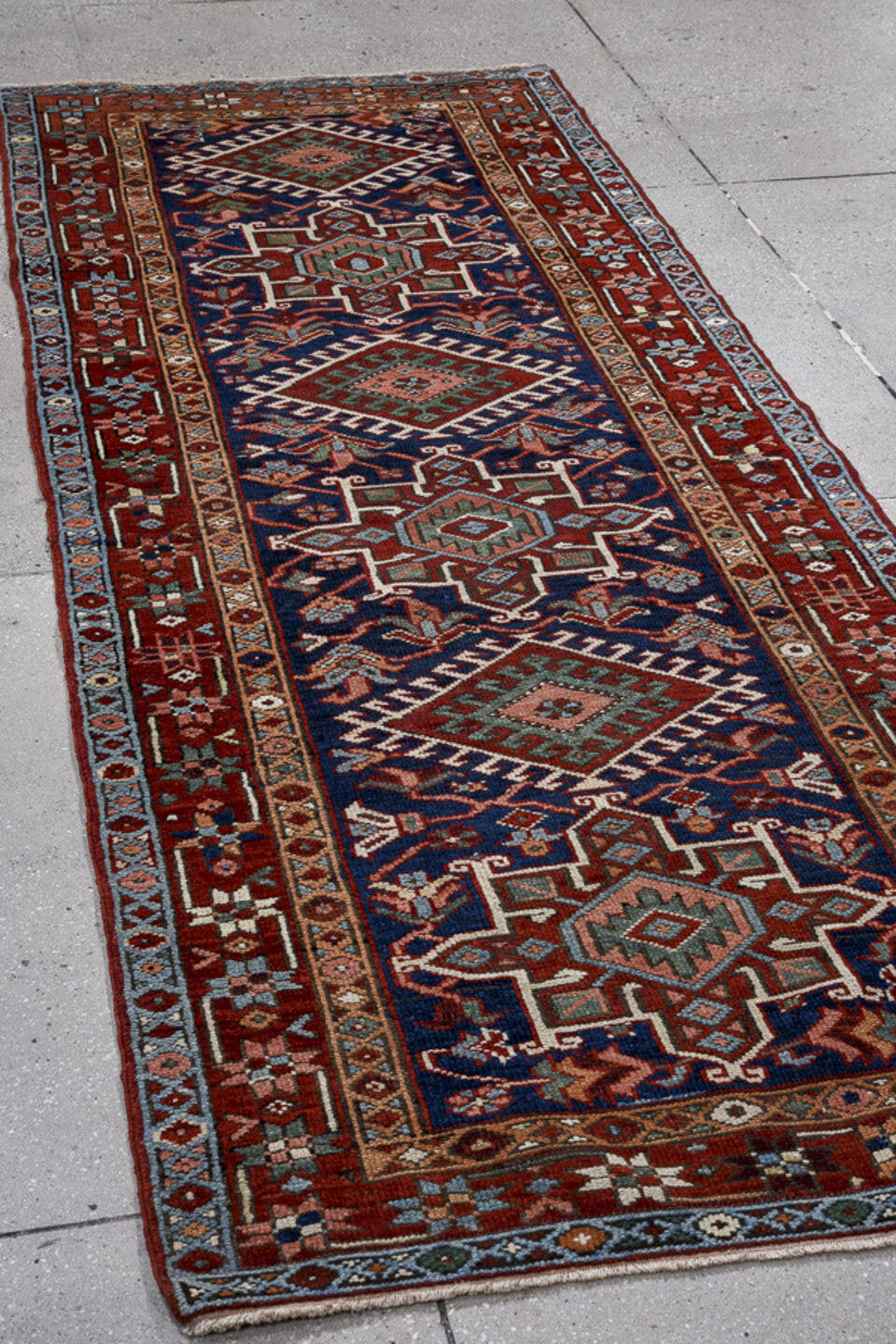3' x 8' one-of-a-kind handmade antique Karaje runner rug. Color palette: navy, rust, sky blue, ivory, terracotta, sage
