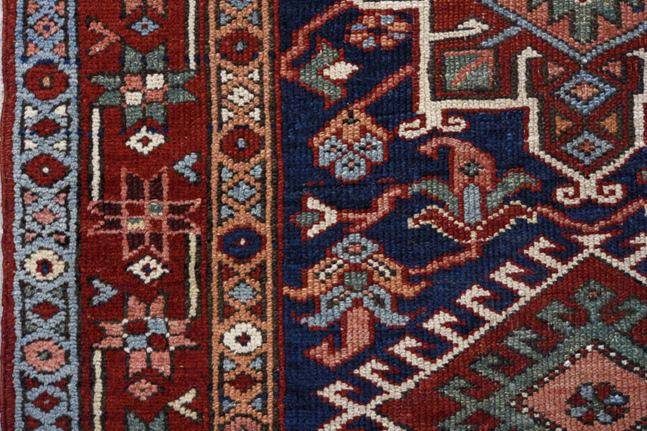 3' x 8' one-of-a-kind handmade antique Karaje runner rug. Color palette: navy, rust, sky blue, ivory, terracotta, sage