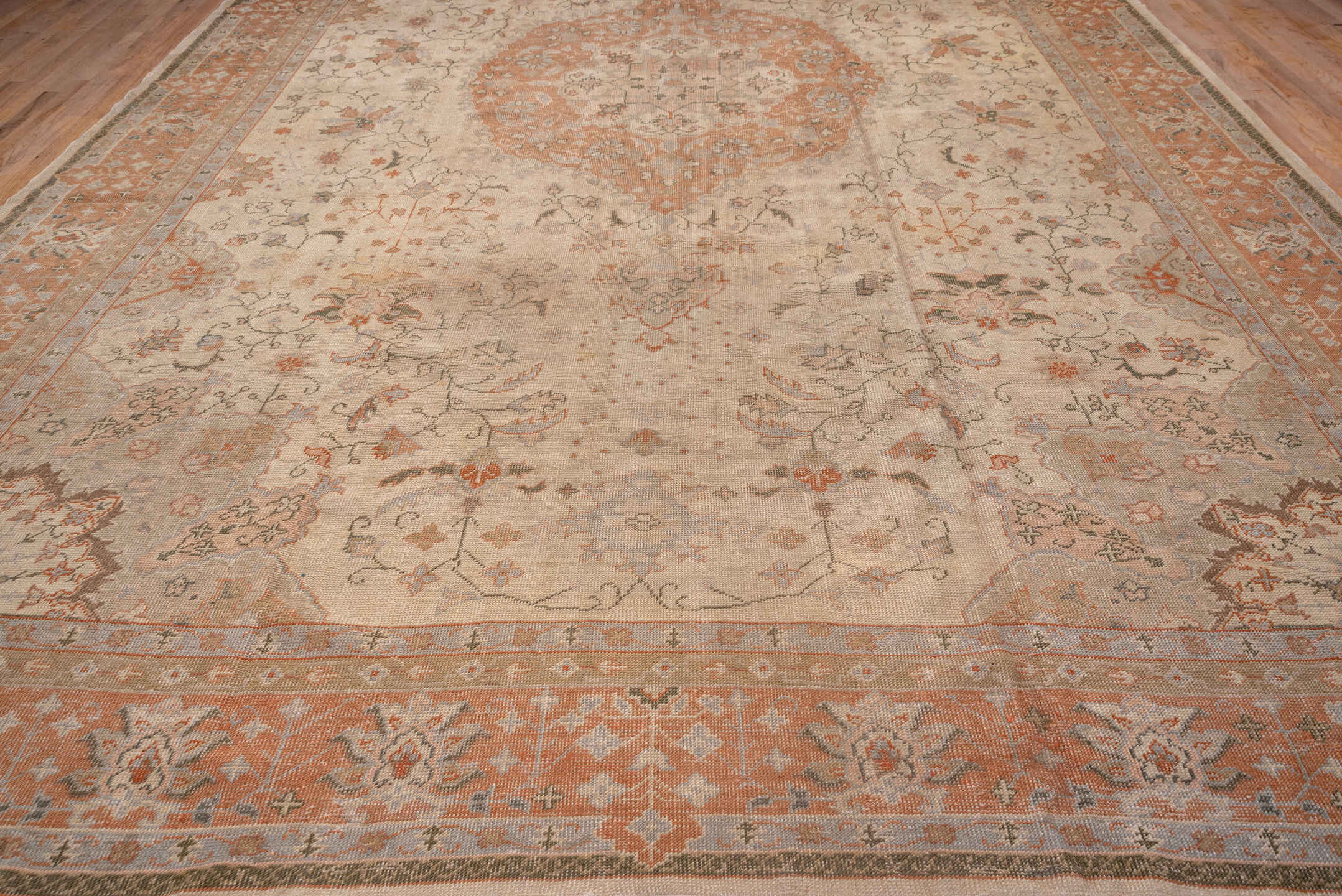 13' x 20' one-of-a-kind handmade antique Oushak oversize rug. Color palette: ivory, peach, taupe, sage, camel, terracotta
