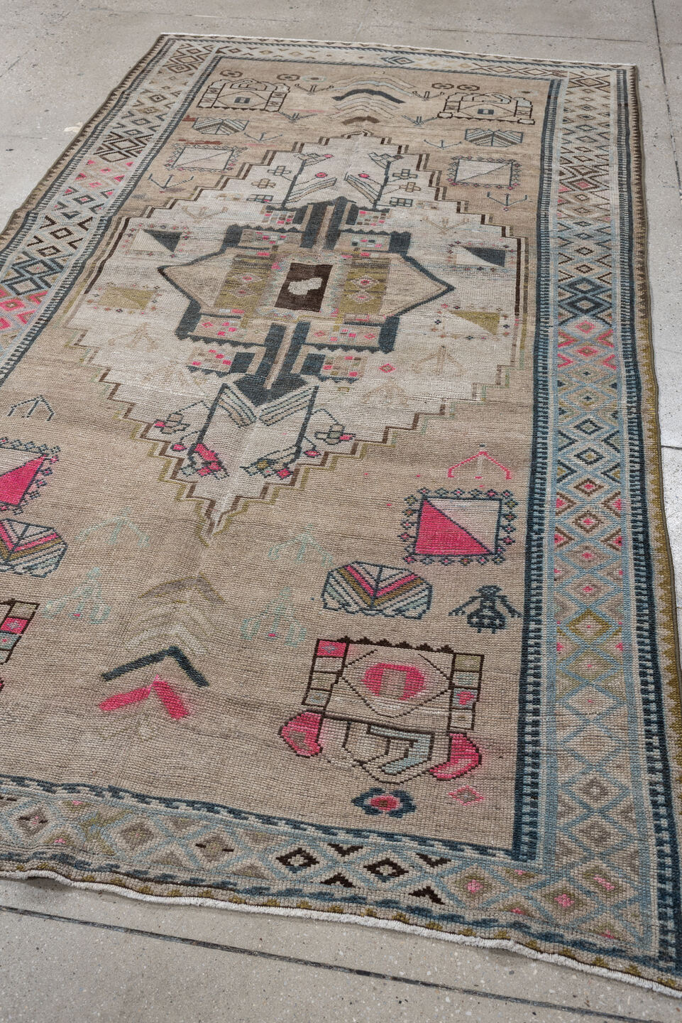 4' x 8' one-of-a-kind handmade vintage Gabbe medium size rug. Color palette: taupe, ivory, charcoal, sky blue, fuchsia