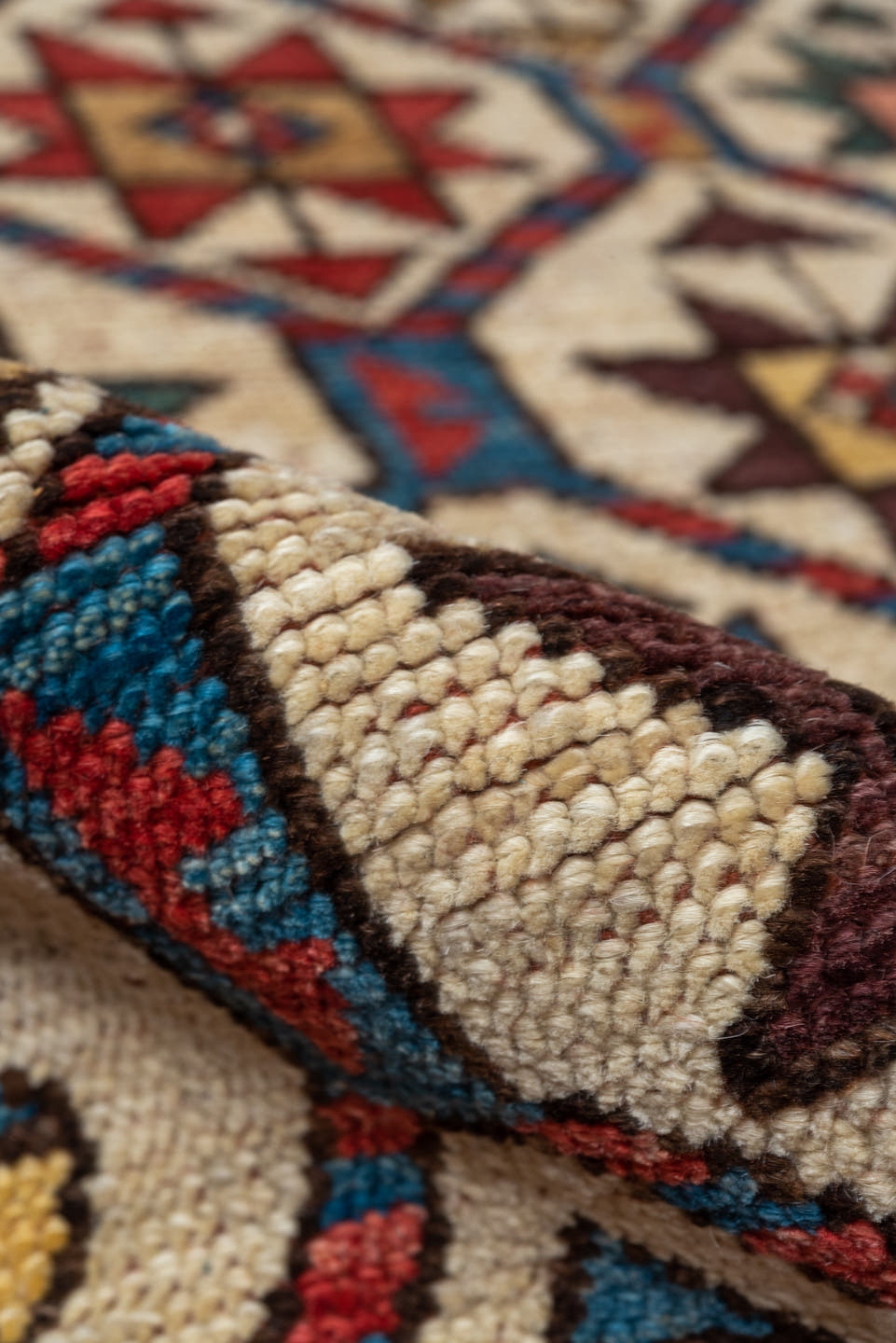 4' x 7' one-of-a-kind handmade vintage Kazak rug. Color palette: red, ivory, sky blue, navy, camel, brown, black, sage