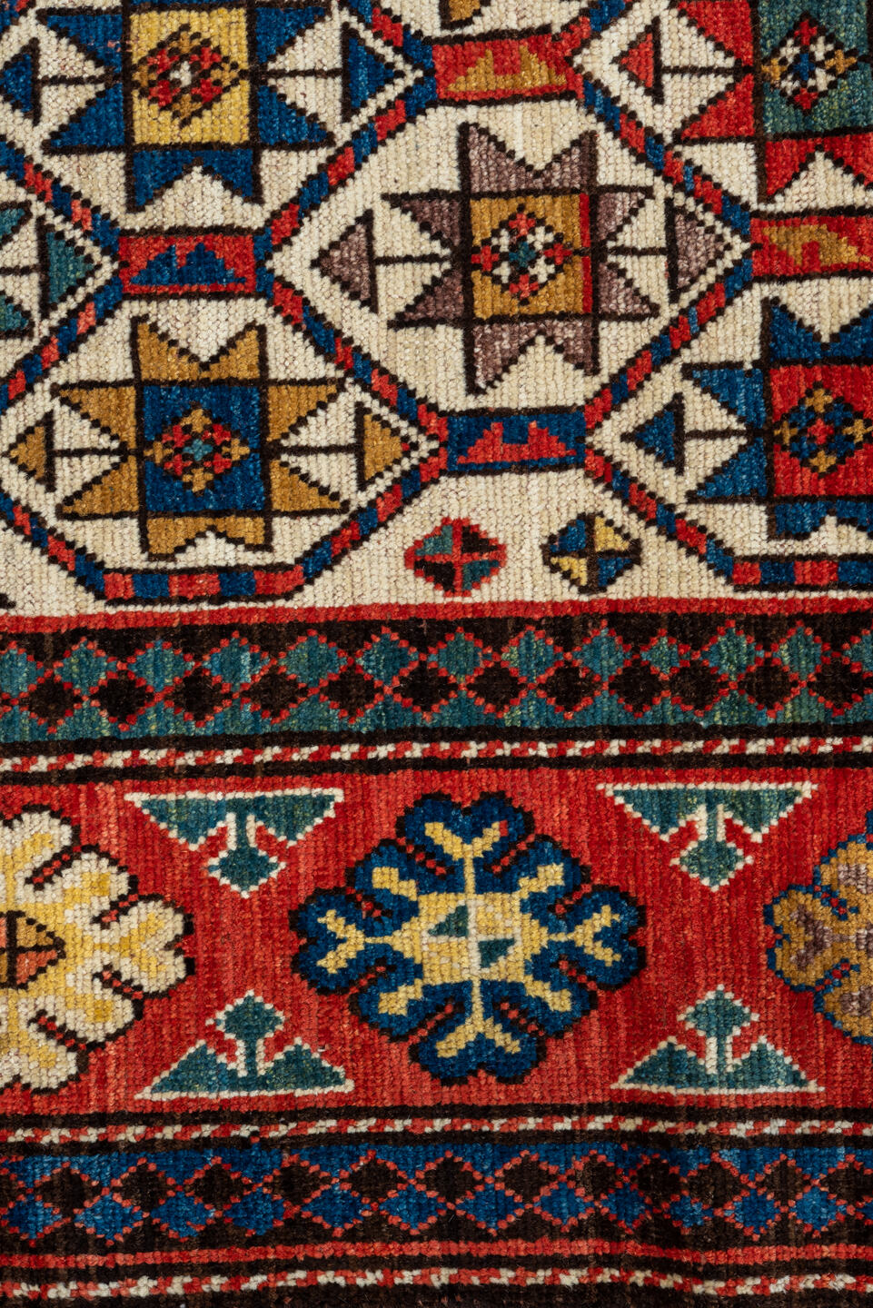 3' x 8' one-of-a-kind handmade vintage Kazak runner rug. Color palette: blue, brown, gray, orange, red
