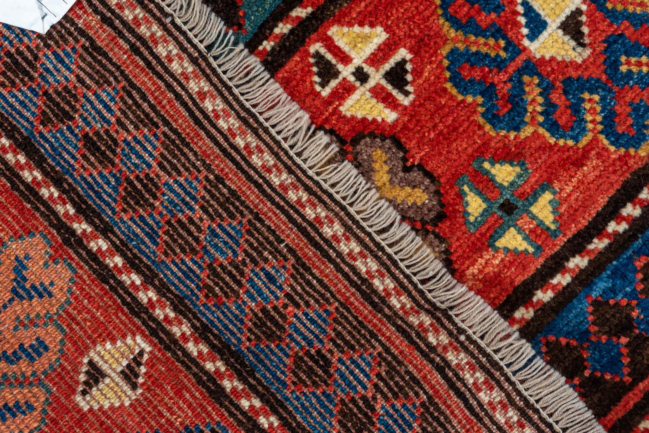 3' x 8' one-of-a-kind handmade vintage Kazak runner rug. Color palette: red, ivory, navy, sky_blue, camel, gold, brown
