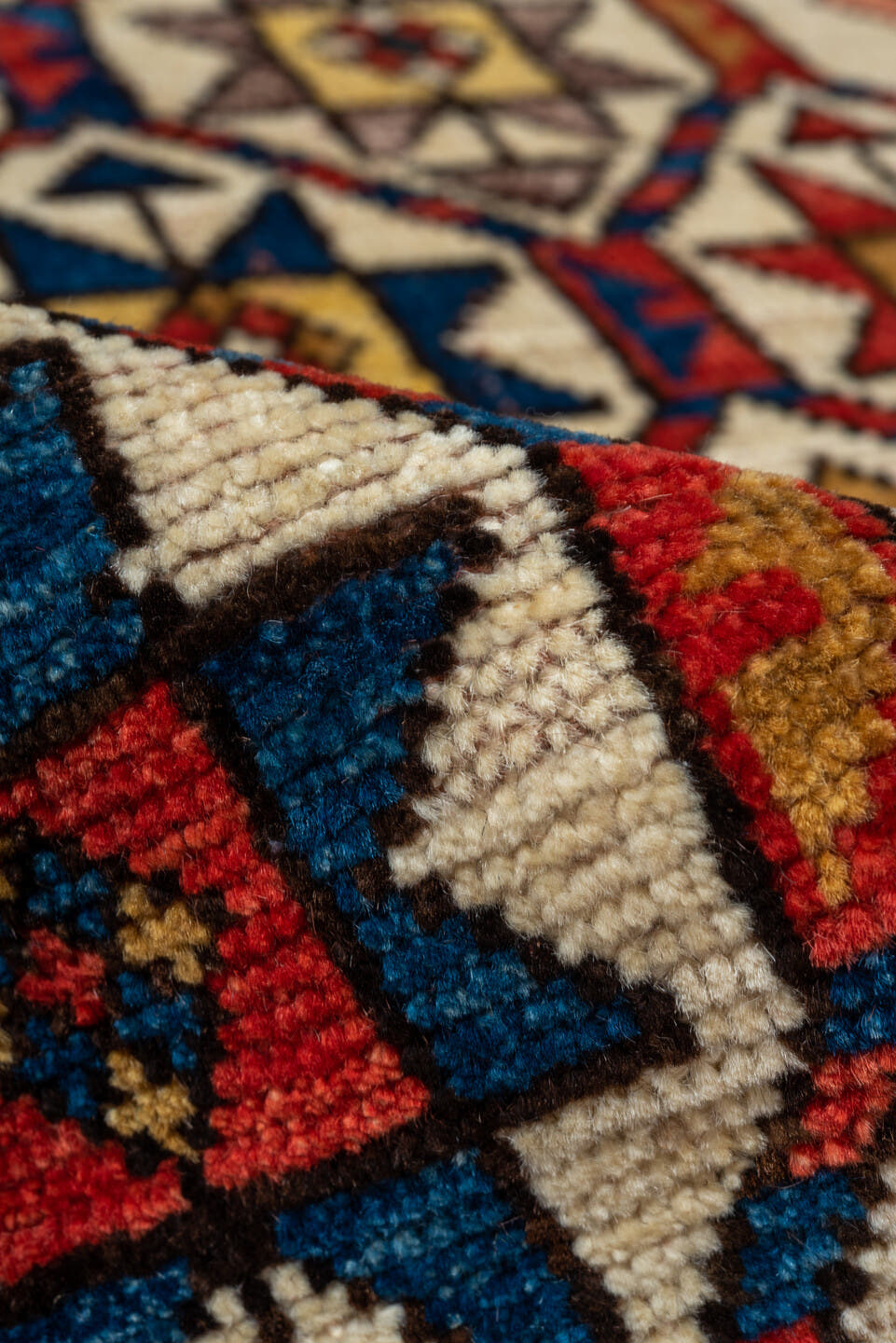 3' x 8' one-of-a-kind handmade vintage Kazak runner rug. Color palette: red, ivory, navy, sky_blue, camel, gold, brown