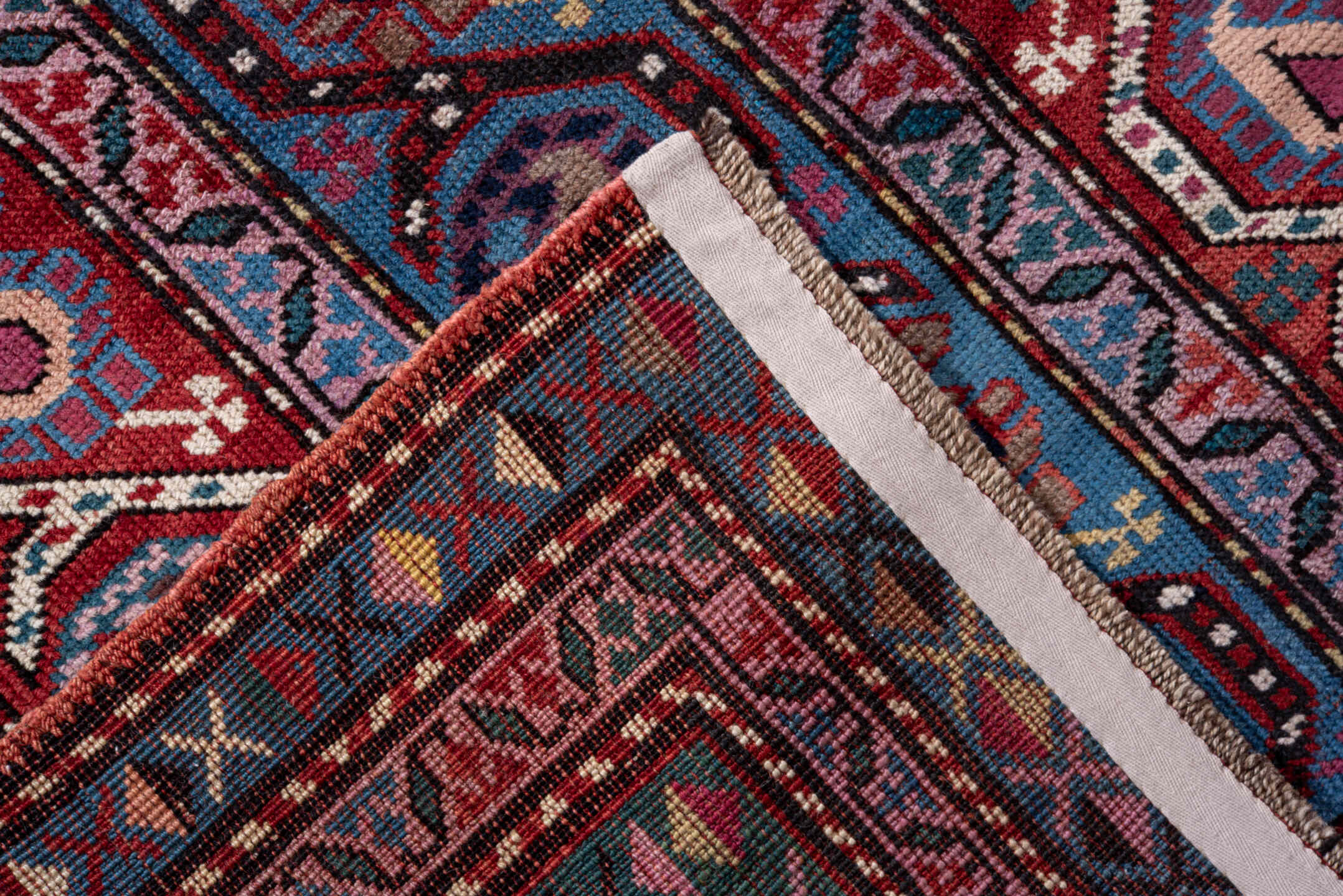 3' x 11' one-of-a-kind handmade vintage Caucasian runner rug. Color palette: gray, blue, red, brown, pink, black, light gray