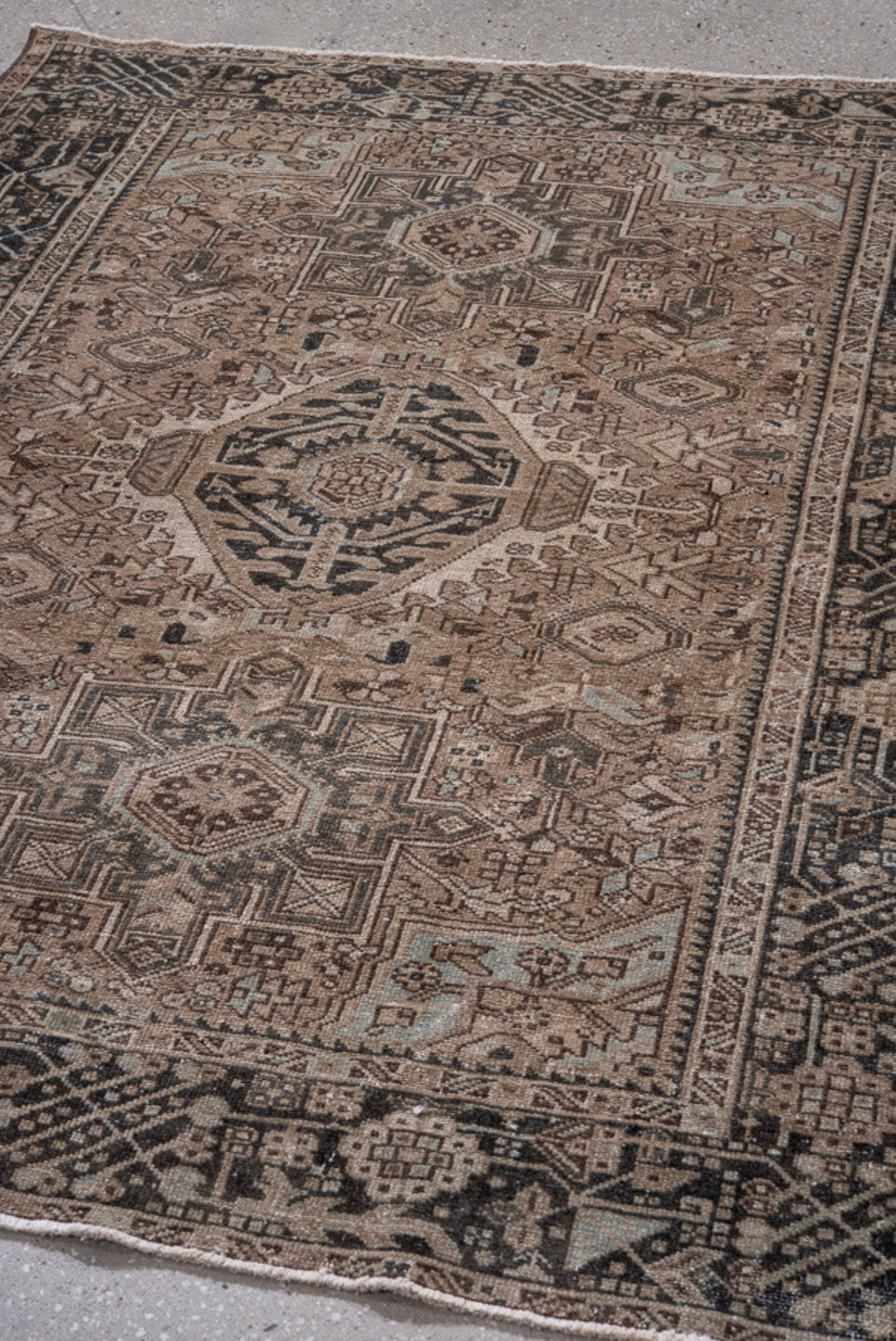 4' x 6' one-of-a-kind handmade vintage Karaje small size rug. Color palette: gray, black, brown, light gray, pink, off-white