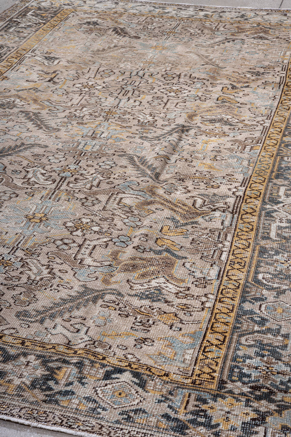 7' x 11' one-of-a-kind handmade antique Heriz large size rug. Color palette: taupe, ivory, charcoal, slate, gold, pale blue