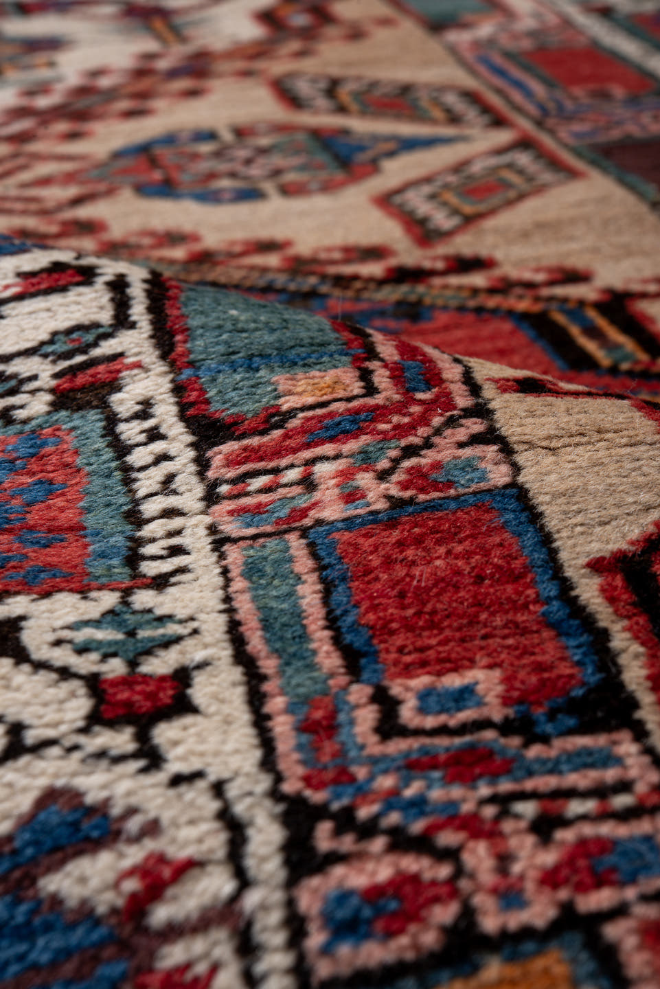 3' x 15' one-of-a-kind handmade antique Sarab runner rug. Color palette: ivory, rust, indigo, crimson, navy, camel, blue