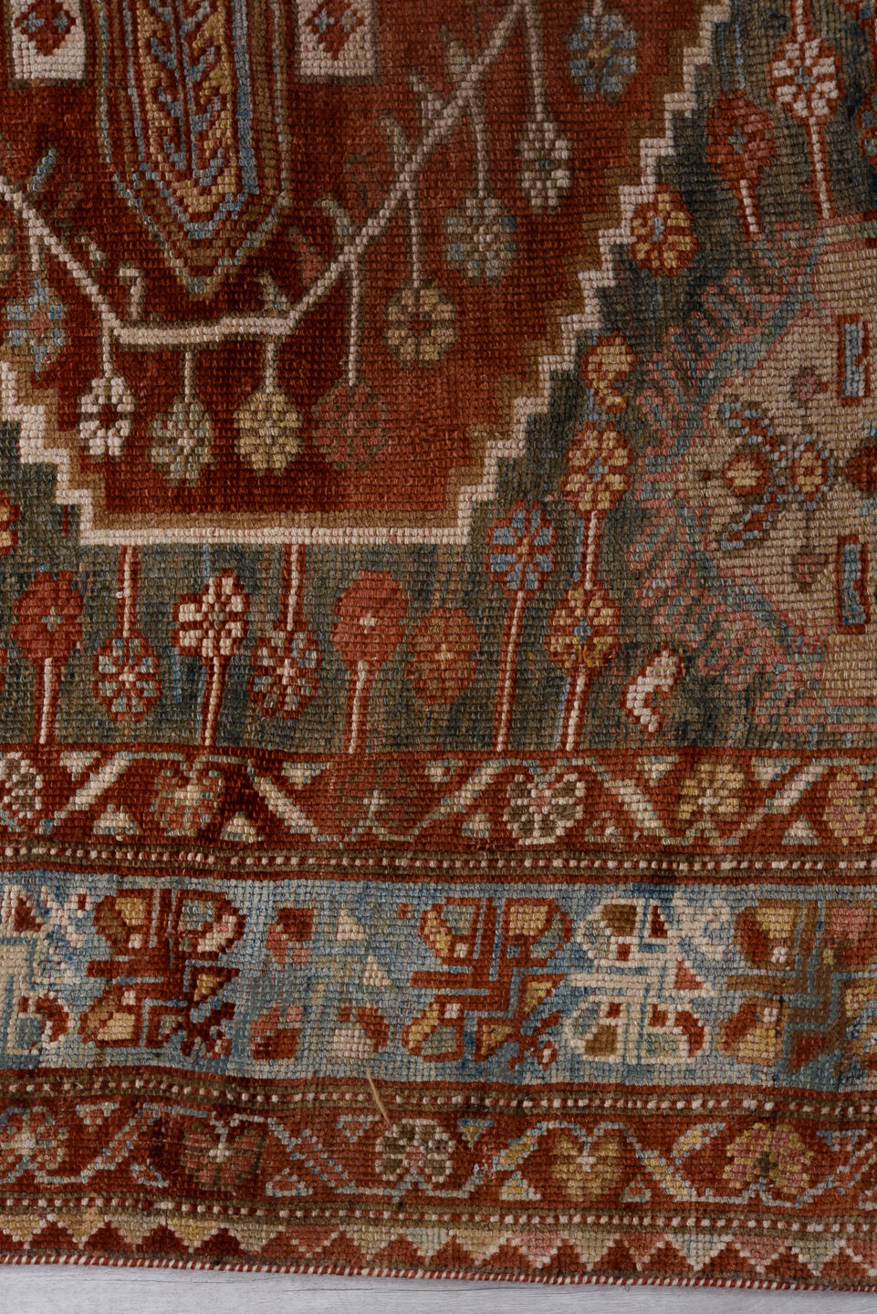 4' x 6' one-of-a-kind handmade antique Baktiary small size rug. Color palette: rust, ivory, sky blue, charcoal, brick, taupe