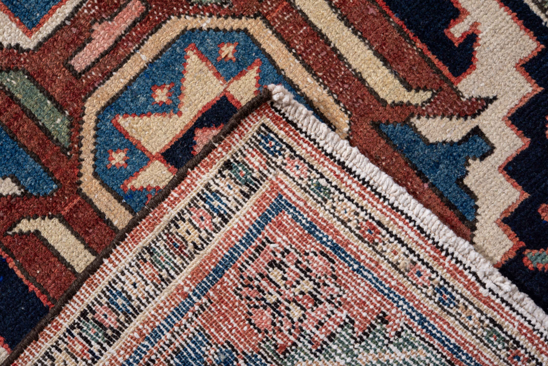 3' x 10' one-of-a-kind handmade antique Karaje runner rug. Color palette: navy, rust, ivory, sky blue, rose, sage, camel