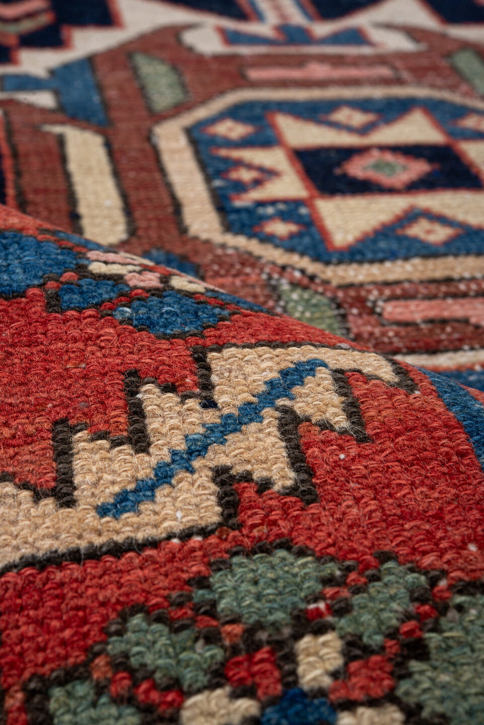 3' x 10' one-of-a-kind handmade antique Karaje runner rug. Color palette: navy, rust, ivory, sky blue, rose, sage, camel