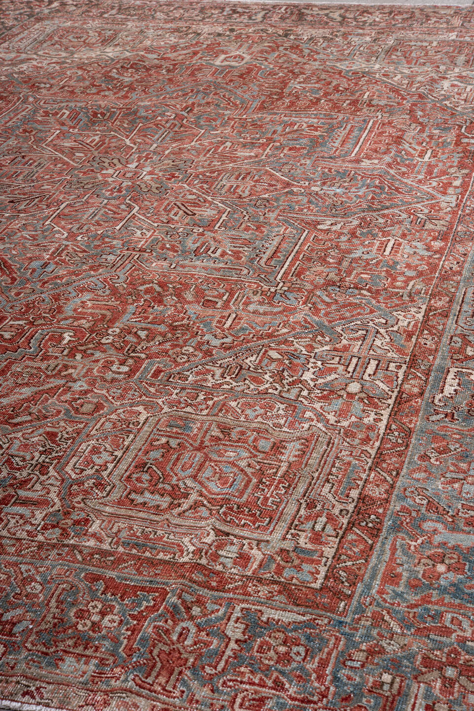 8' x 12' one-of-a-kind handmade vintage Heriz large size rug. Color palette: rust, ivory, sky blue, brick, taupe, charcoal
