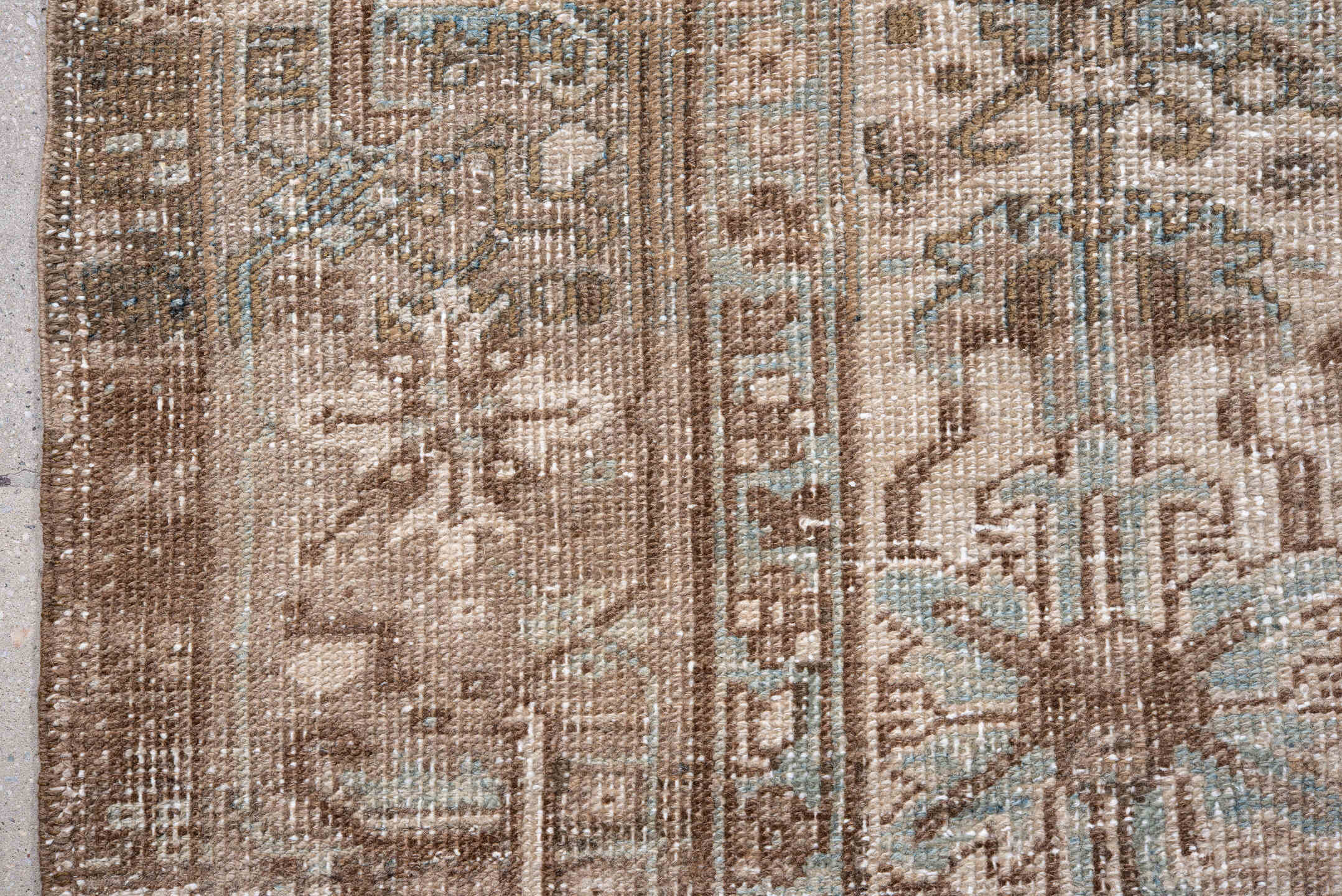 7' x 9' one-of-a-kind handmade antique Heriz rug. Color palette: taupe, brown, ivory, pale blue, beige, gray, light blue
