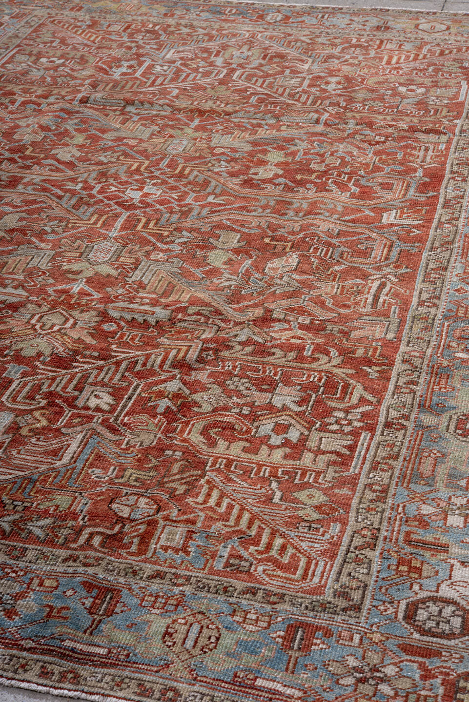 7' x 10' one-of-a-kind handmade vintage Heriz large size rug. Color palette: rust, sky blue, ivory, taupe, sage, burgundy