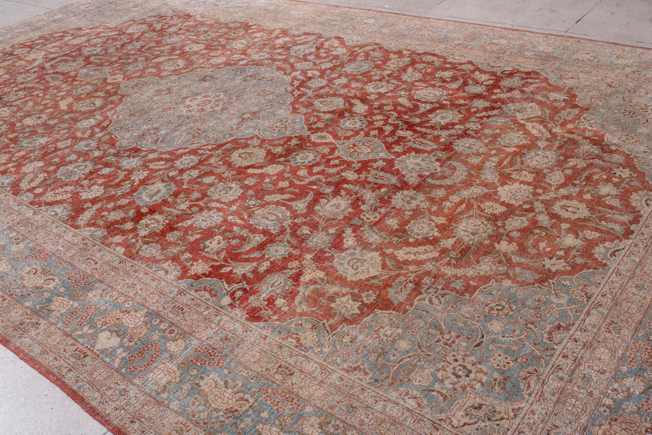 10' x 17' one-of-a-kind handmade antique Kashan rug. Color palette: rust, light blue, ivory, terra cotta, beige, taupe