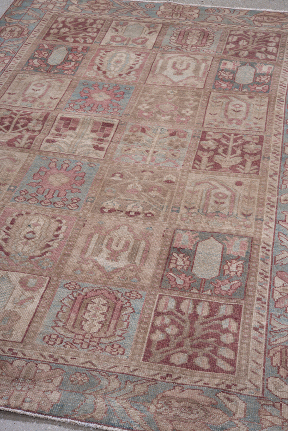 4' x 6' one-of-a-kind handmade antique Baktiary small size rug. Color palette: ivory, sky blue, rose, taupe, dusty pink