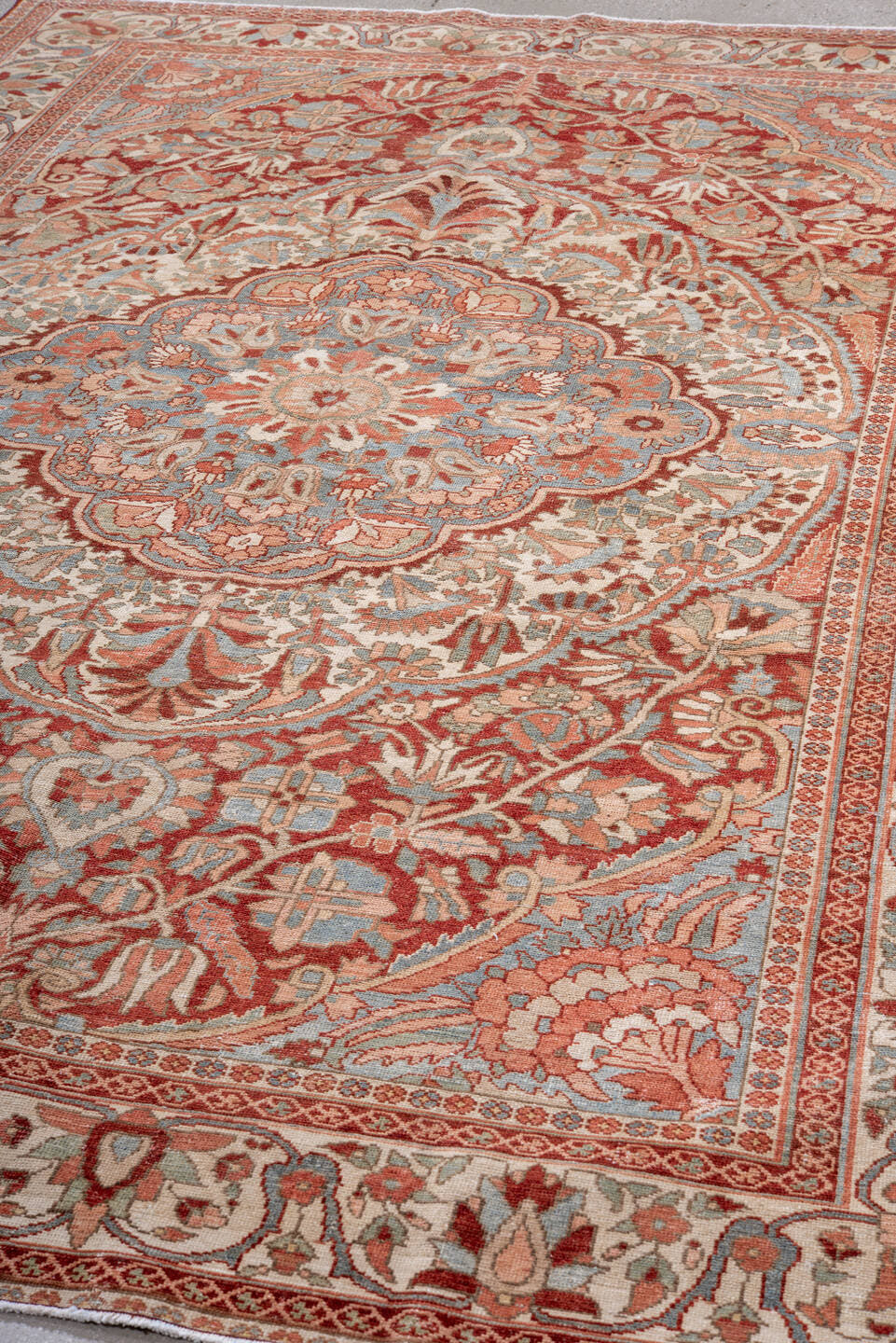 7' x 10' one-of-a-kind handmade vintage Baktiary large size rug. Color palette: ivory, rose, light blue, rust, burgundy