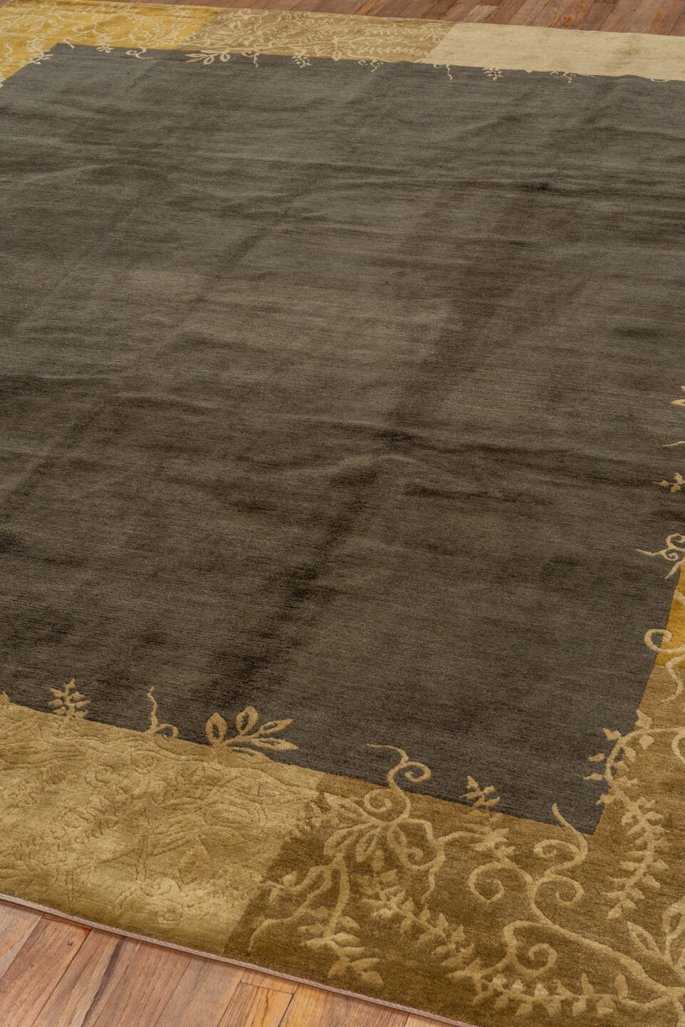8' x 10' one-of-a-kind handmade vintage Tibetan large size rug. Color palette: charcoal, camel, gold, taupe, brown, ivory