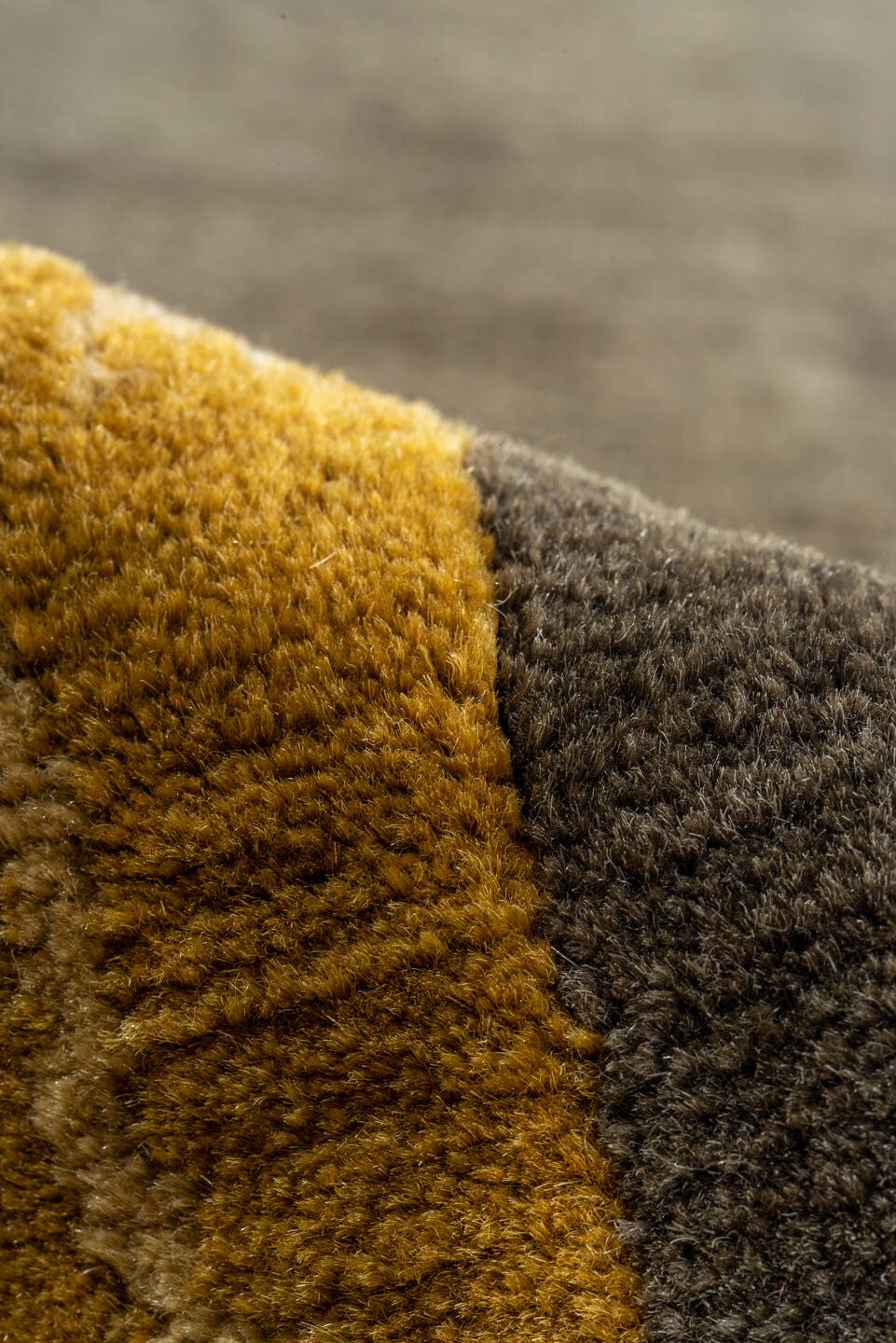 8' x 10' one-of-a-kind handmade vintage Tibetan large size rug. Color palette: charcoal, camel, gold, taupe, brown, ivory