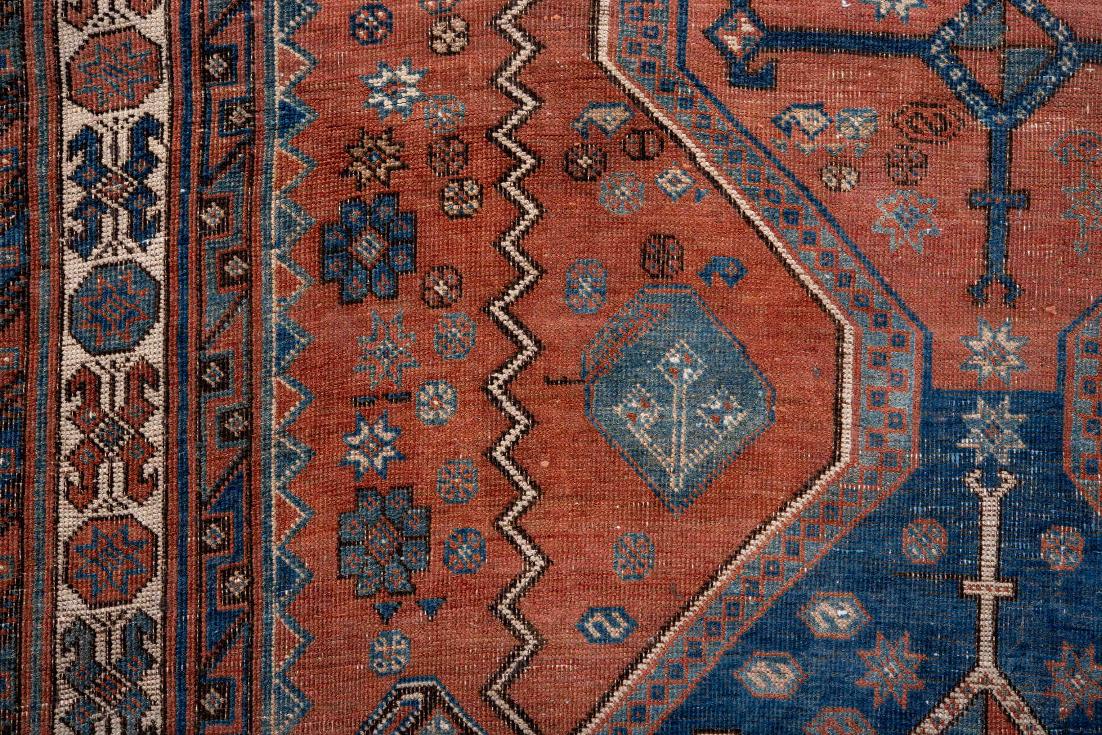 4' x 6' one-of-a-kind handmade antique Afshar small size rug. Color palette: terra cotta, indigo, ivory, rust, slate, camel