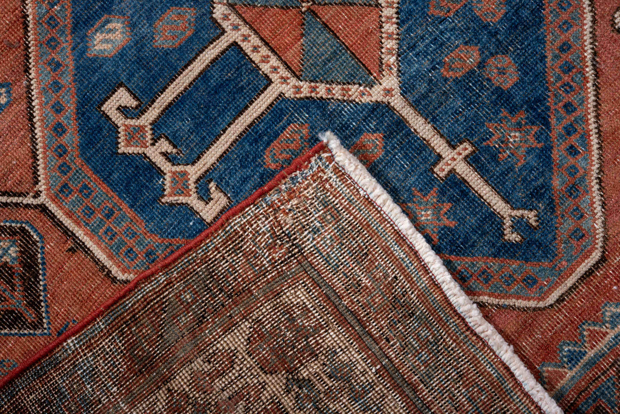 4' x 6' one-of-a-kind handmade antique Afshar small size rug. Color palette: terra cotta, indigo, ivory, rust, slate, camel