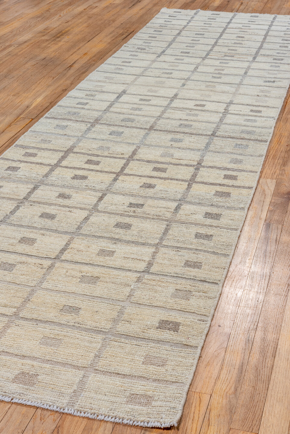 3' x 11' one-of-a-kind handmade vintage Tulu runner rug. Color palette: gray, light gray, off-white, pink, silver, snow