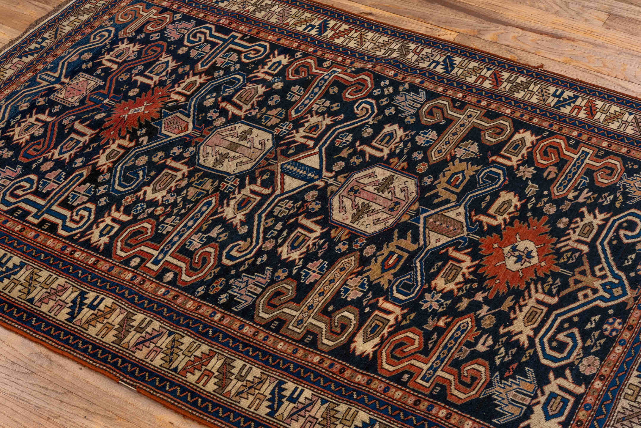3' x 5' one-of-a-kind handmade antique Perpedil small size rug. Color palette: navy, ivory, camel, sky_blue, rust, rose