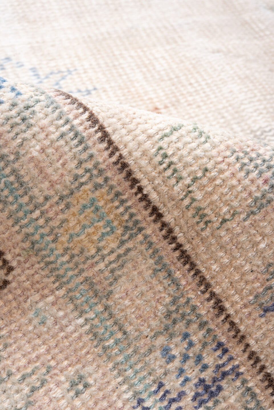 7' x 9' one-of-a-kind handmade antique Sparta rug. Color palette: ivory, blush, pale blue, sand, taupe, sage, peach, pink