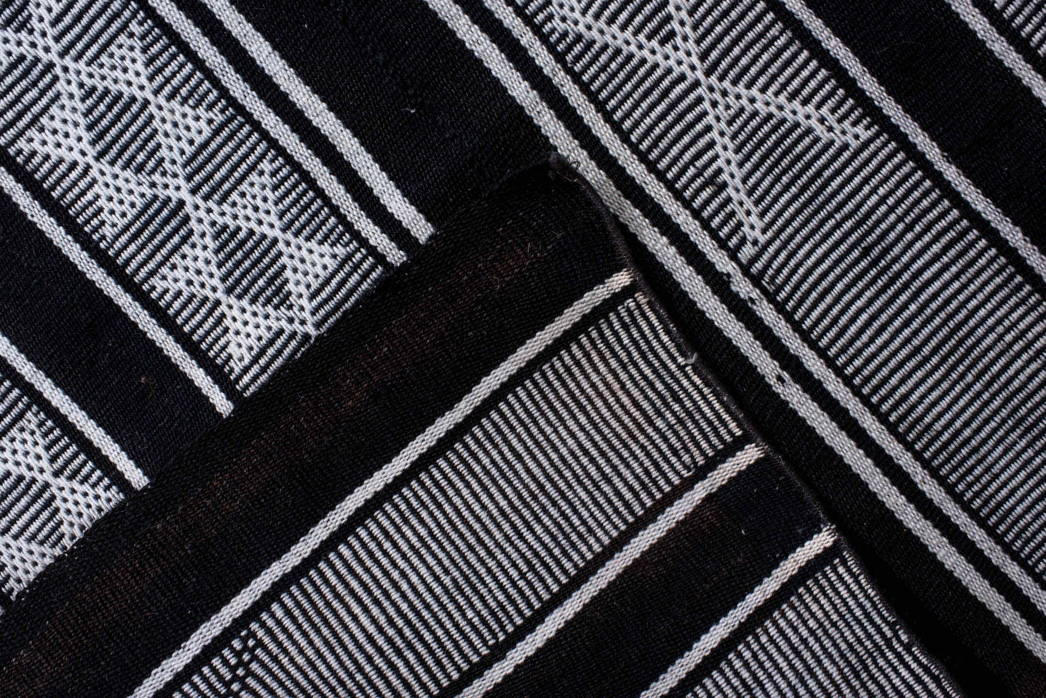 5' x 11' one-of-a-kind handmade vintage Flatweave rug. Color palette: black, blue, charcoal, dark gray, gray, lavender