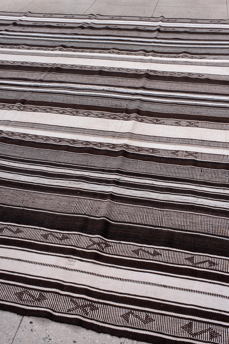 12' x 13' one-of-a-kind handmade antique Flatweave oversize rug. Color palette: ivory, charcoal, brown, taupe, gray, black