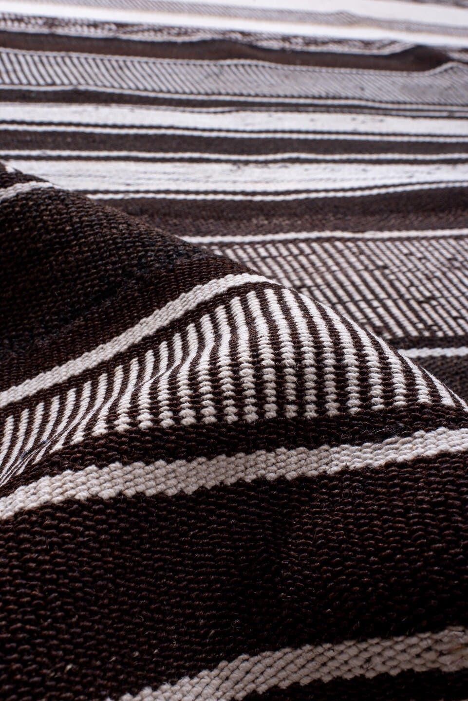 12' x 13' one-of-a-kind handmade antique Flatweave oversize rug. Color palette: ivory, charcoal, brown, taupe, gray, black