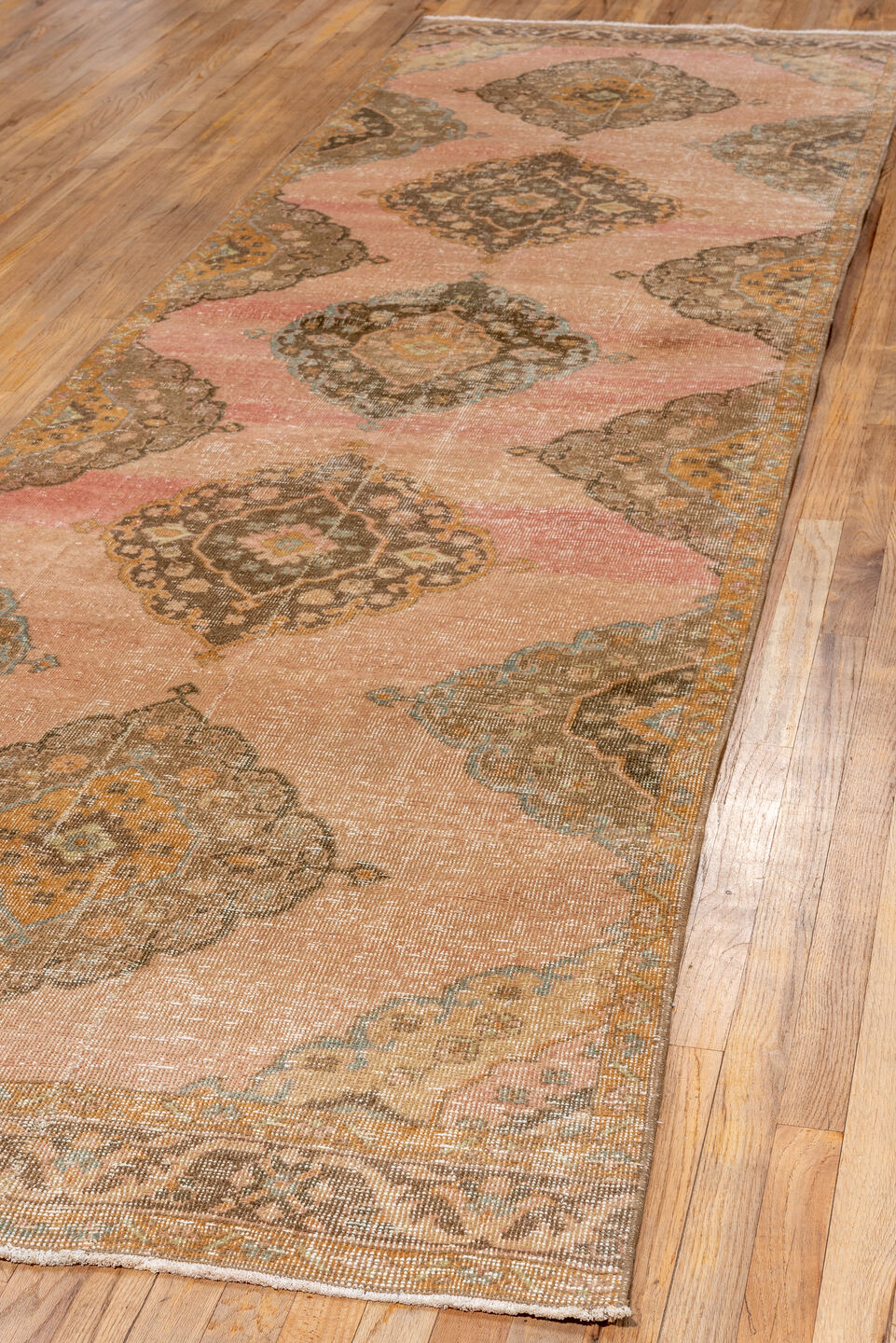 3' x 12' one-of-a-kind handmade vintage Oushak runner rug. Color palette: brown, off-white, orange, pink, snow, white