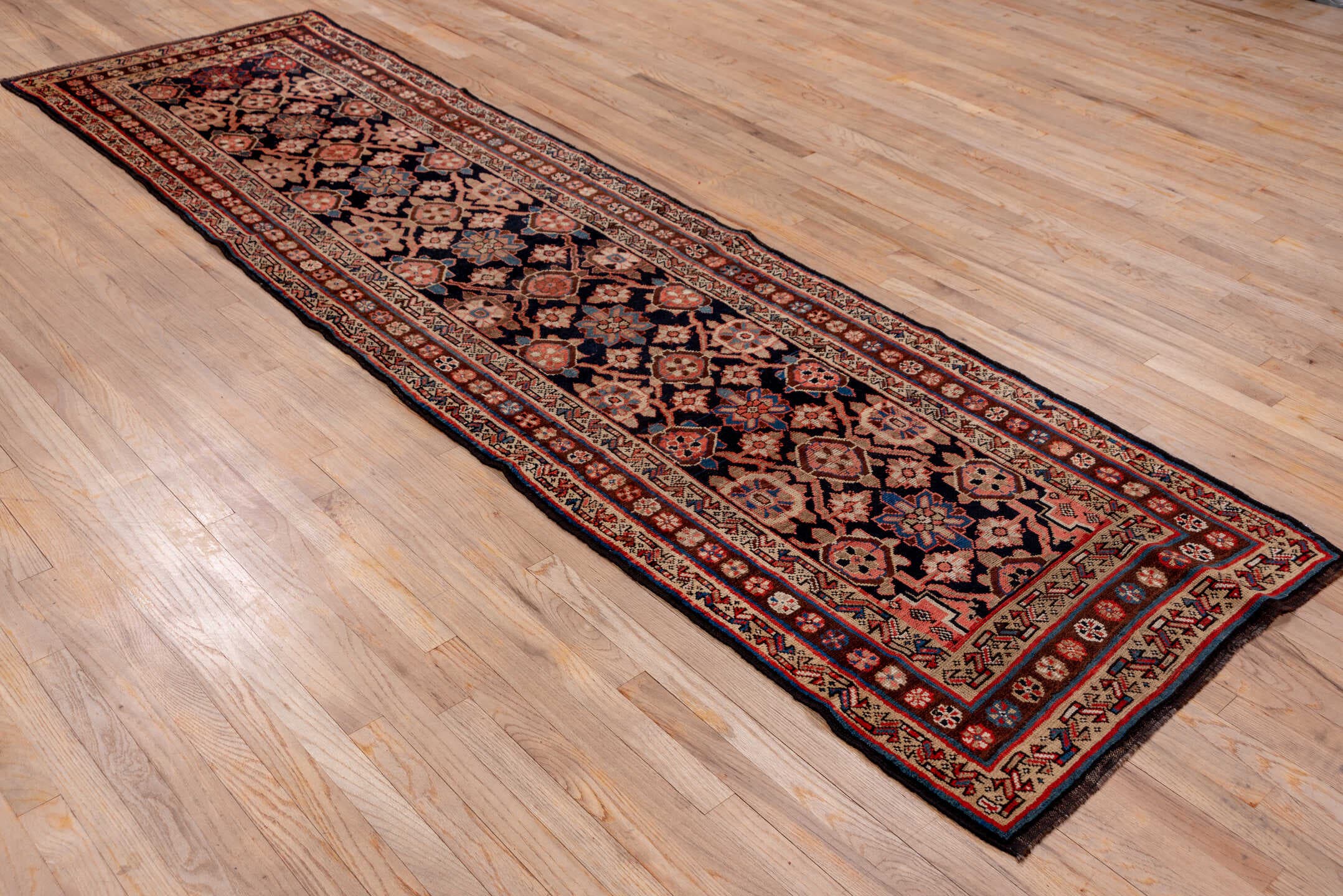 3' x 11' one-of-a-kind handmade antique Kurd runner rug. Color palette: navy, ivory, rust, crimson, camel, slate, blue
