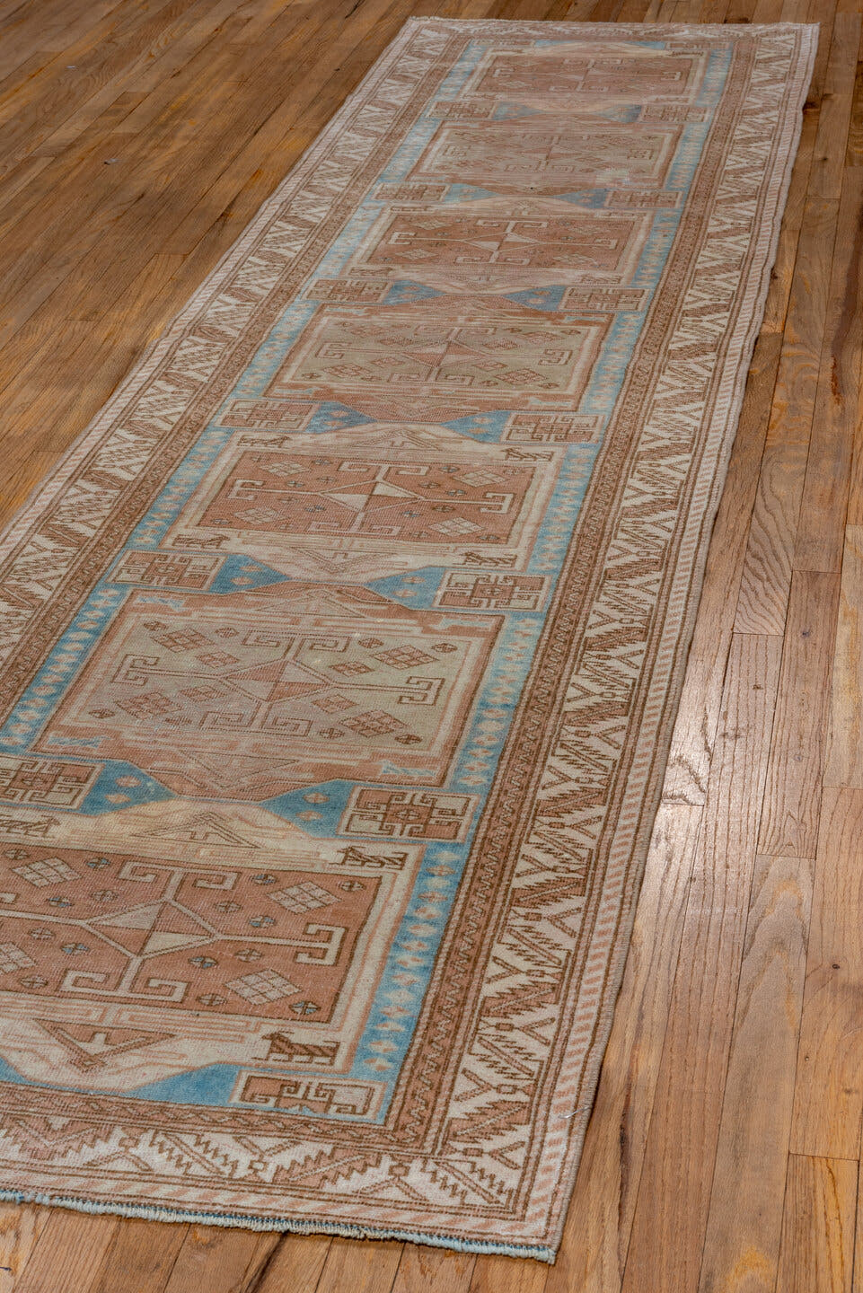 2' x 11' one-of-a-kind handmade antique Oushak runner rug. Color palette: ivory, blush, sky blue, taupe, camel, pink