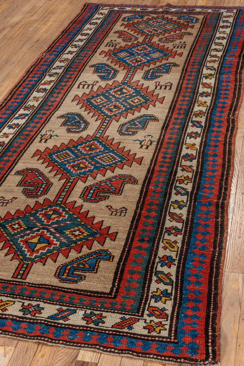 3' x 9' one-of-a-kind handmade antique Sarab runner rug. Color palette: ivory, rust, indigo, blue, brick, gold, charcoal