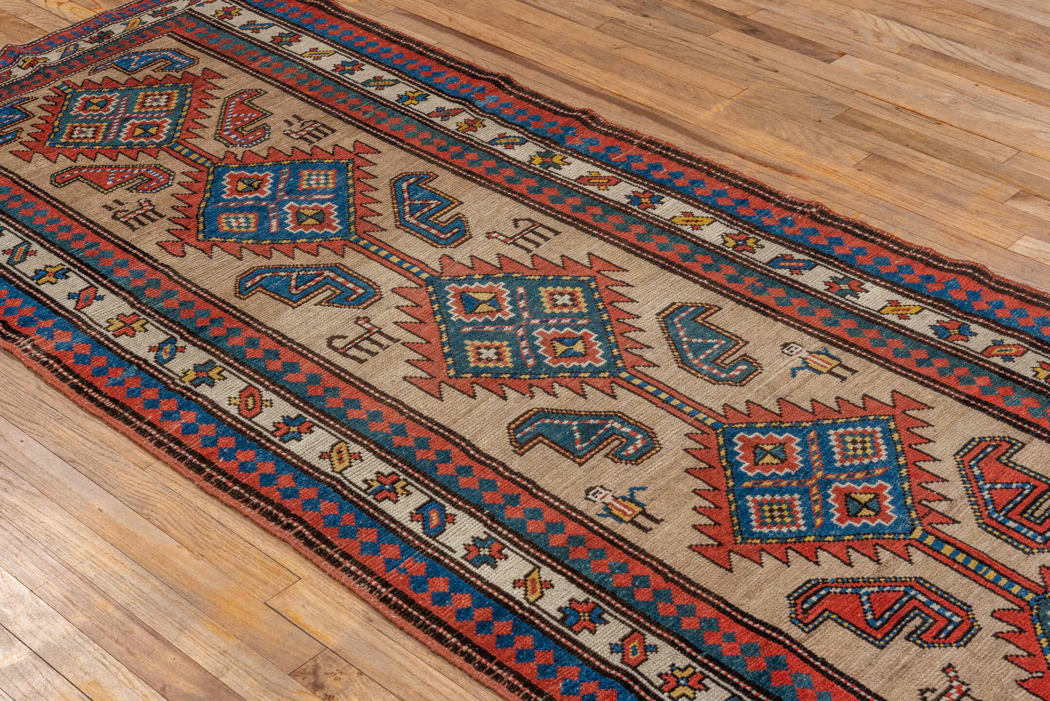 3' x 9' one-of-a-kind handmade antique Sarab runner rug. Color palette: ivory, rust, indigo, blue, brick, gold, charcoal